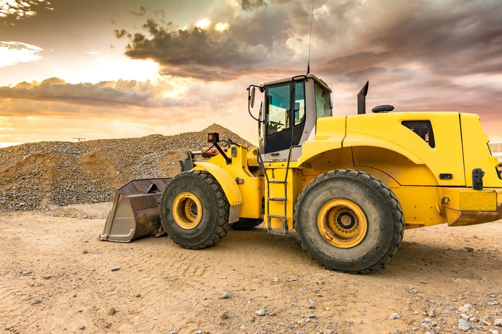 Yellow Loader on a Construction Site With Piles of Gravel — Compass Equipment Hire in Brunswick Heads, NSW