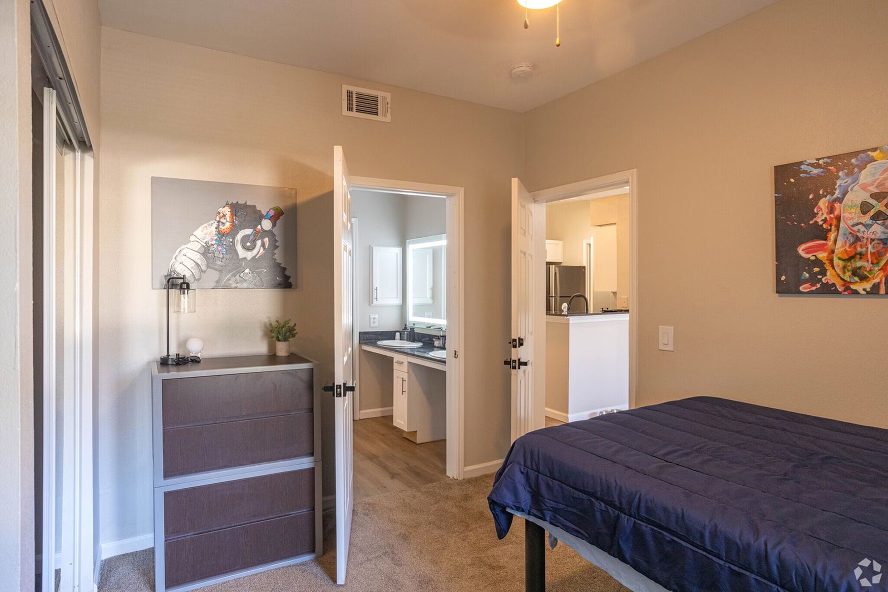 Bedroom at Milestone Stillwater with private bathroom access and furnished layout.