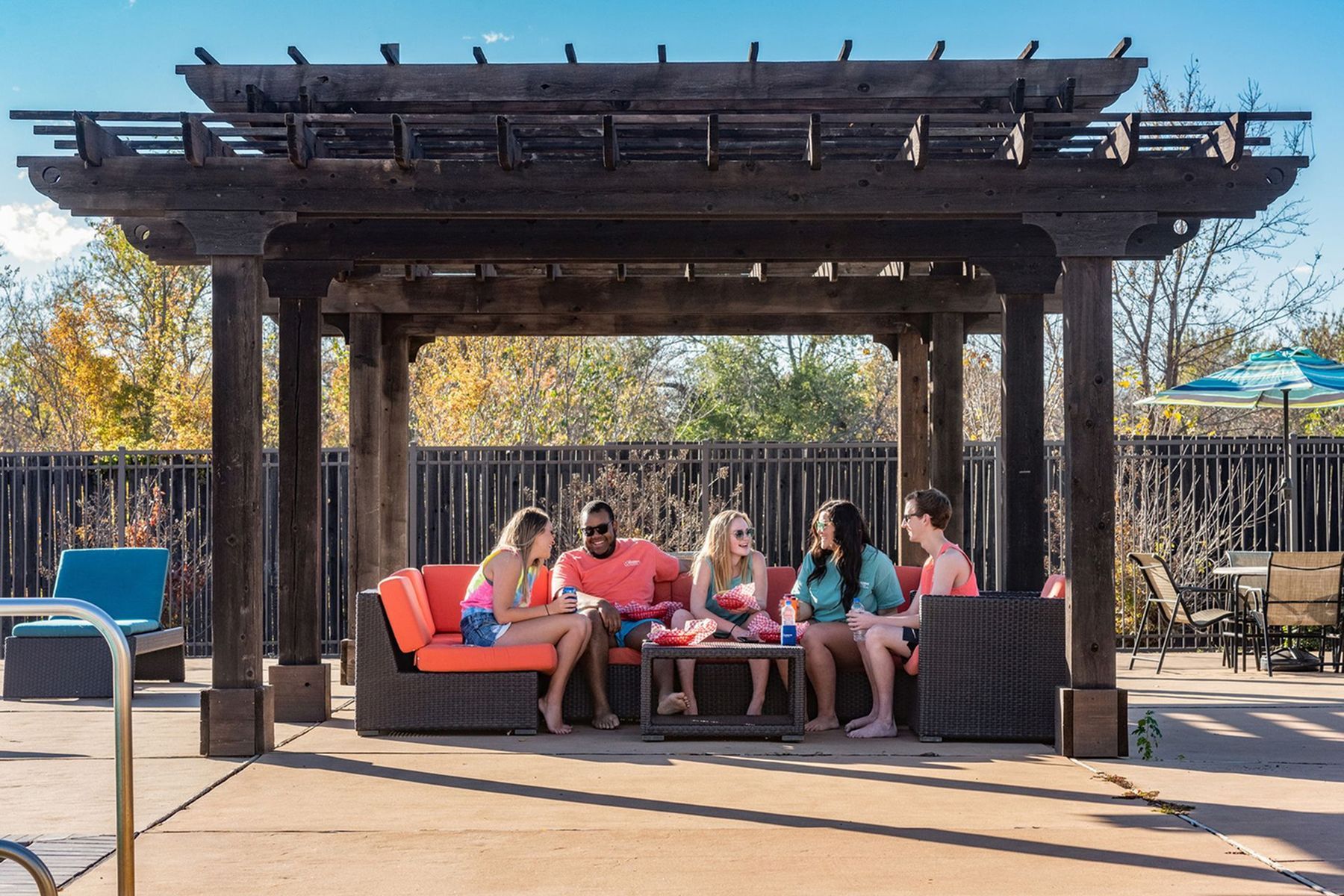 Outdoor pergola lounge area at Milestone Stillwater with student seating and gathering space.