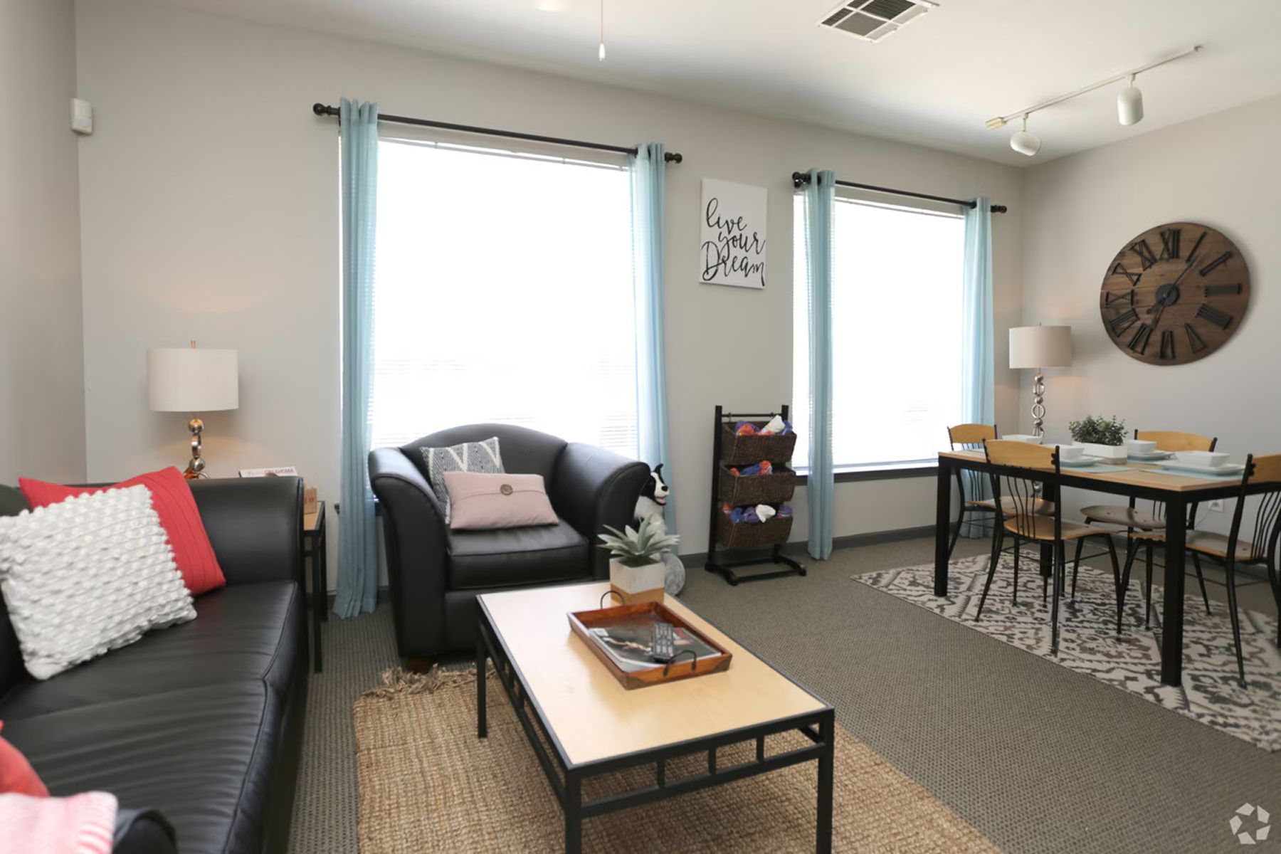 Bright living and dining space in Milestone Stillwater student apartments with modern décor.