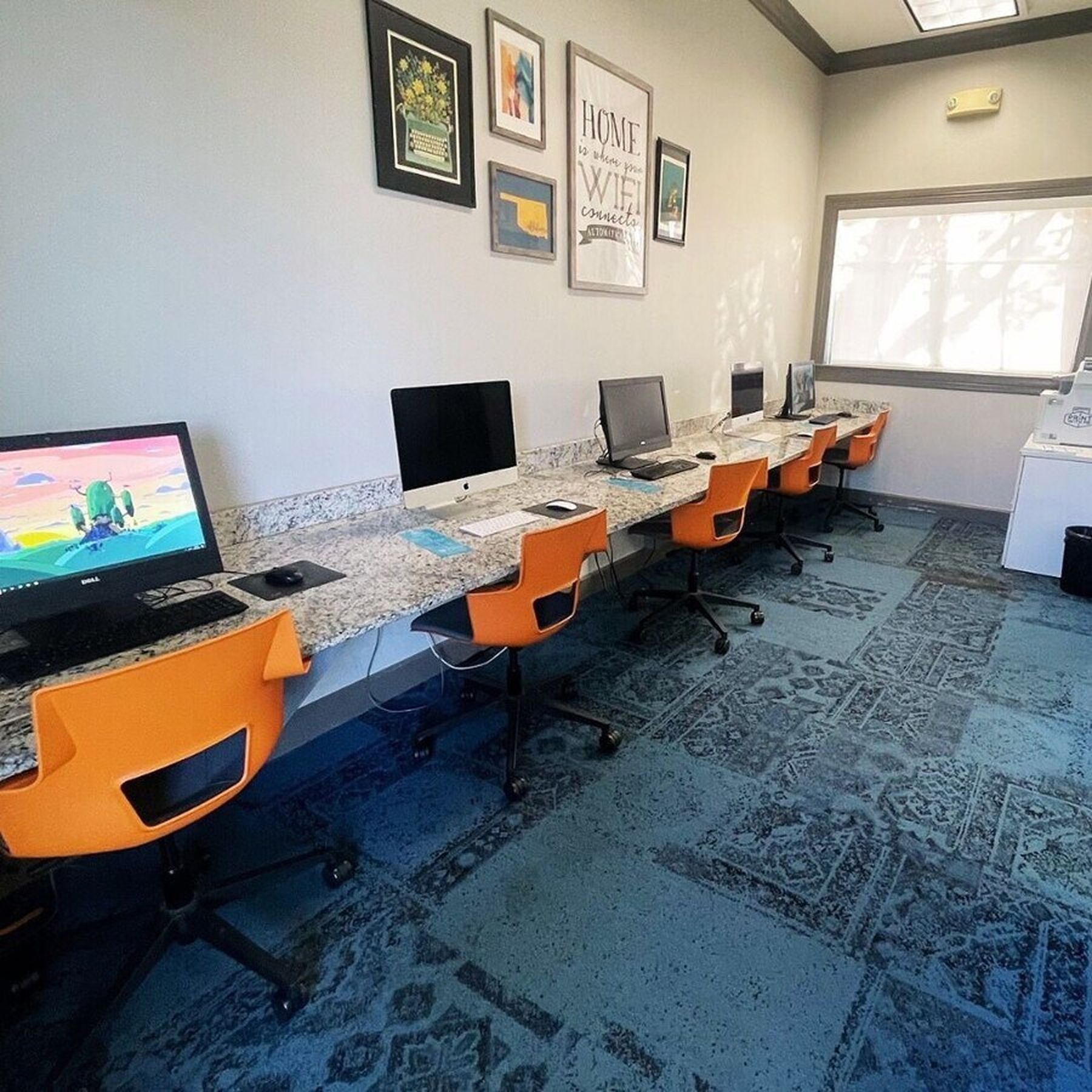Computer study lounge at Milestone Stillwater with desks, monitors, and quiet workspace for students.