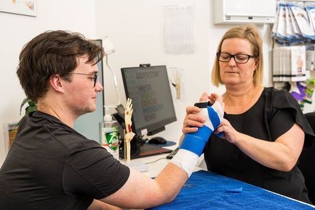 View of a trainer helping the customer 