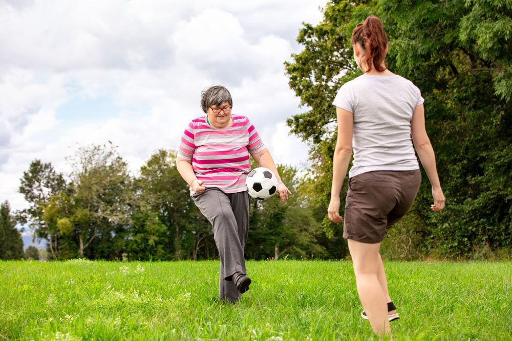 Image of Two Women Engaged in a Soccer Game — Learn to Live in Currajong, QLD