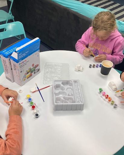 A Group of Children Are Sitting at a Table Playing With Toys — Learn to Live in Currajong, QLD