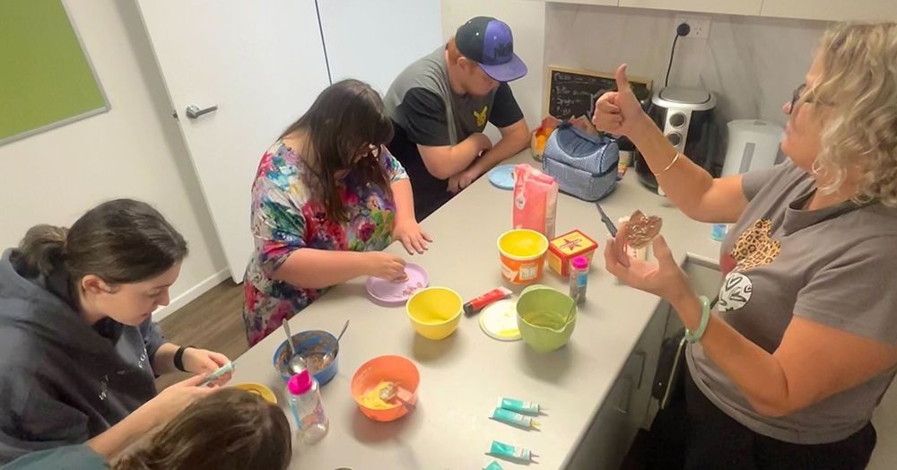A Group of People Are Sitting Around a Table With Bowls of Food — Learn to Live in Belgian Gardens, QLD