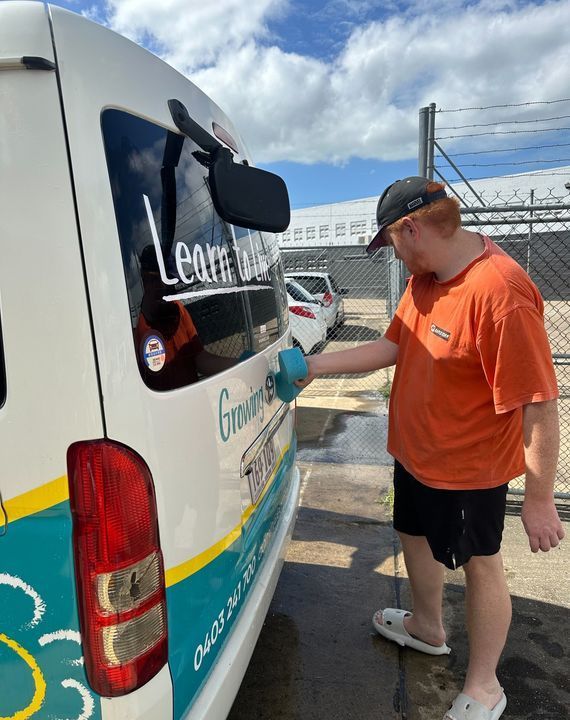 A Man is Standing Next to a White Van That Says Learn — Learn to Live in Currajong, QLD