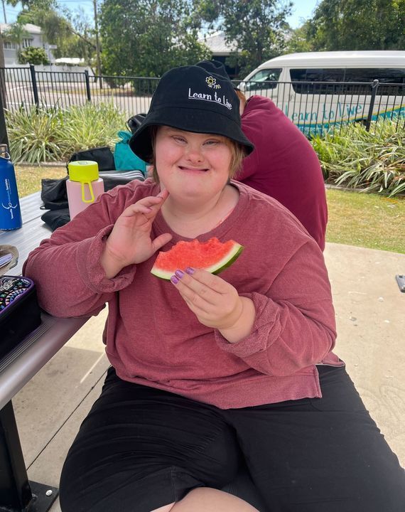 A Woman at a Table, Savouring a Piece of Watermelon — Learn to Live in Currajong, QLD
