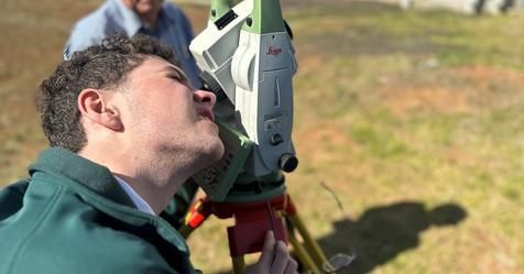 Man Is Looking Through A Surveyor In A Field — Surveyor In Canowindra, NSW