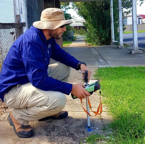 Man Wearing A Hat While Holding A Surveying Tool — Surveyor In Canowindra, NSW