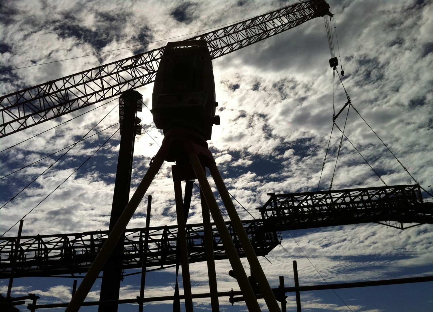 Surveyor Silhouetted Against A Cloudy Sky — Surveyor In Canowindra, NSW