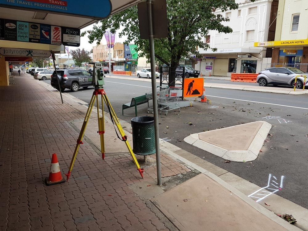 Surveying Equipment Placed on Tripot for a Street Under Construction — Surveyor In Canowindra, NSW