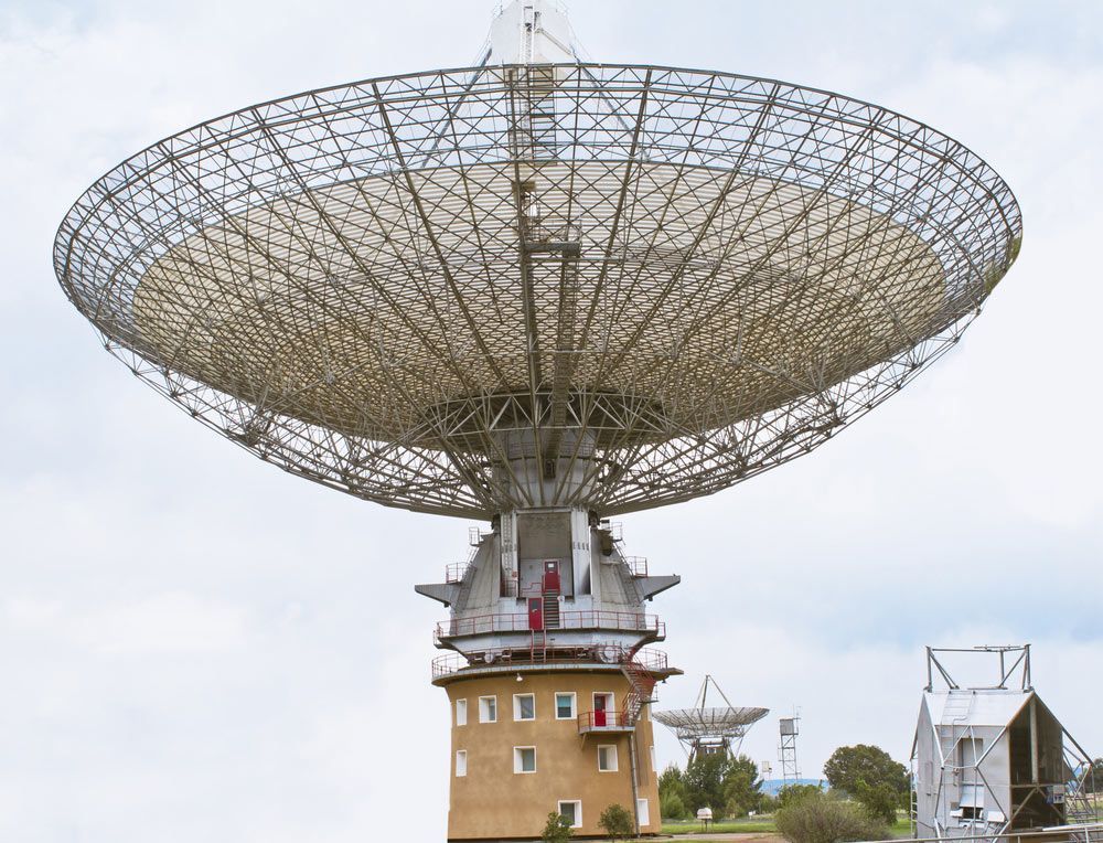 Large Satellite Telescope Dish On Top Of A Building — Surveyor In Parkes, NSW