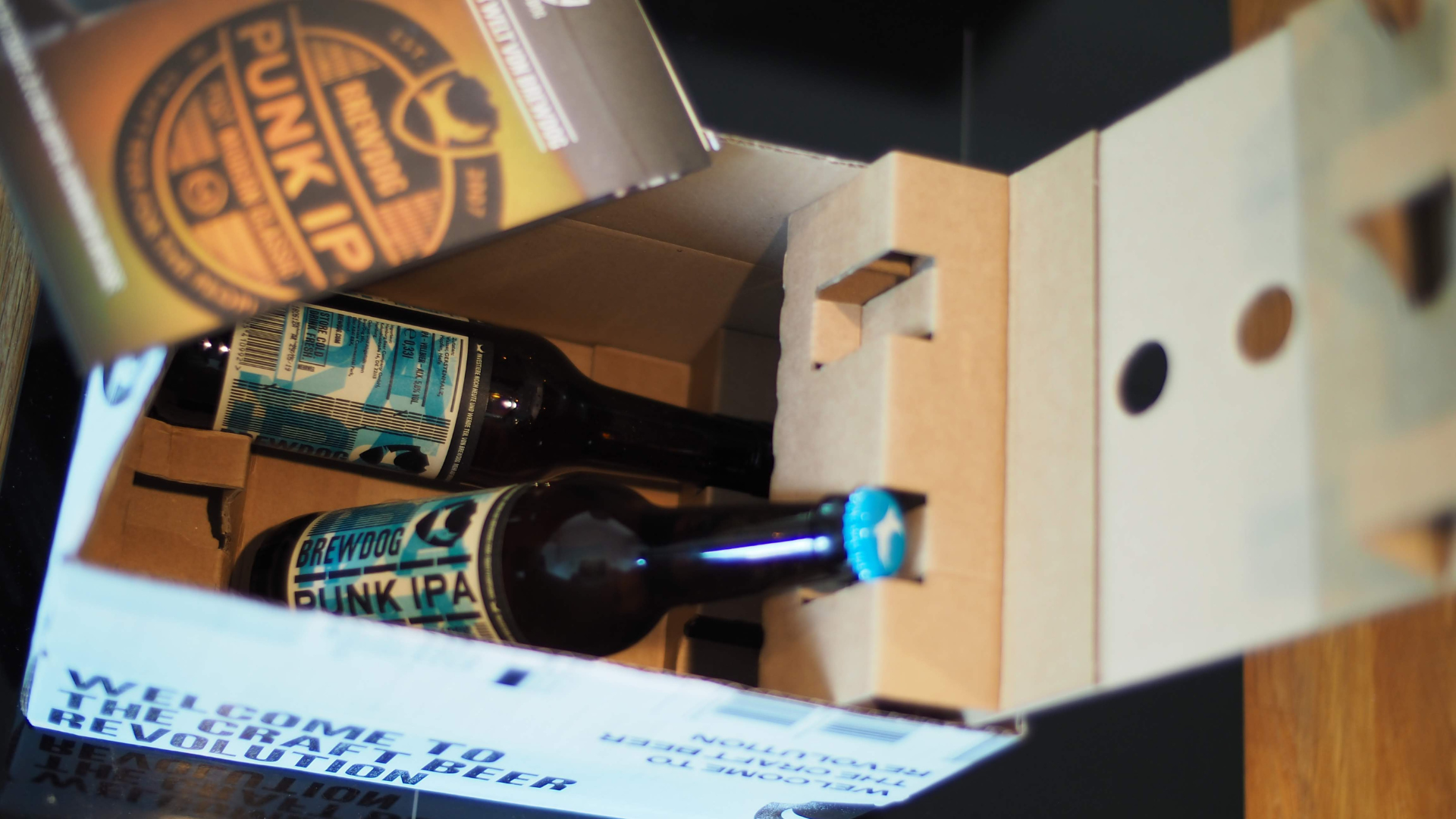 Two bottles of punk ipa are in a cardboard box