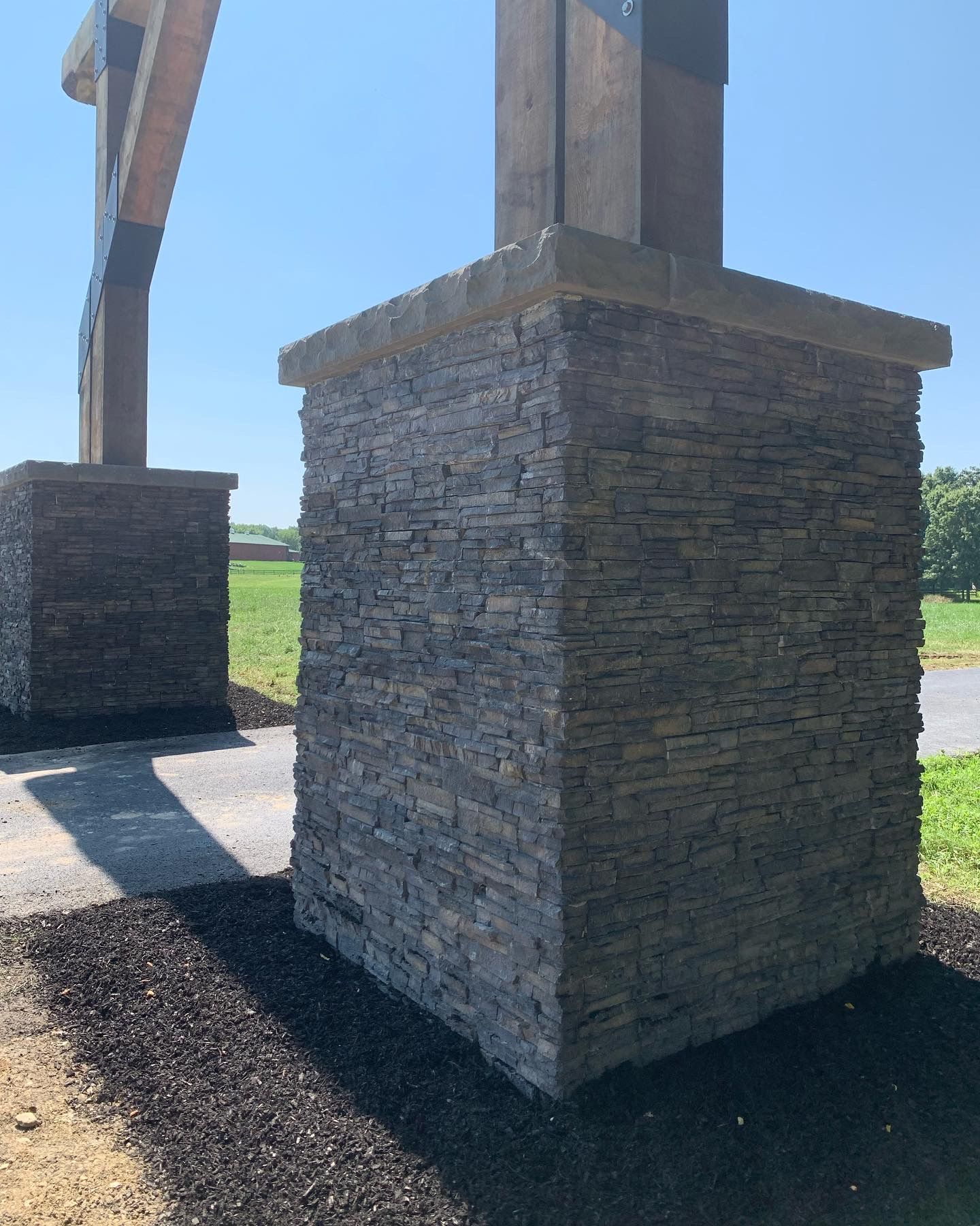 A brick pillar with a sign on top of it