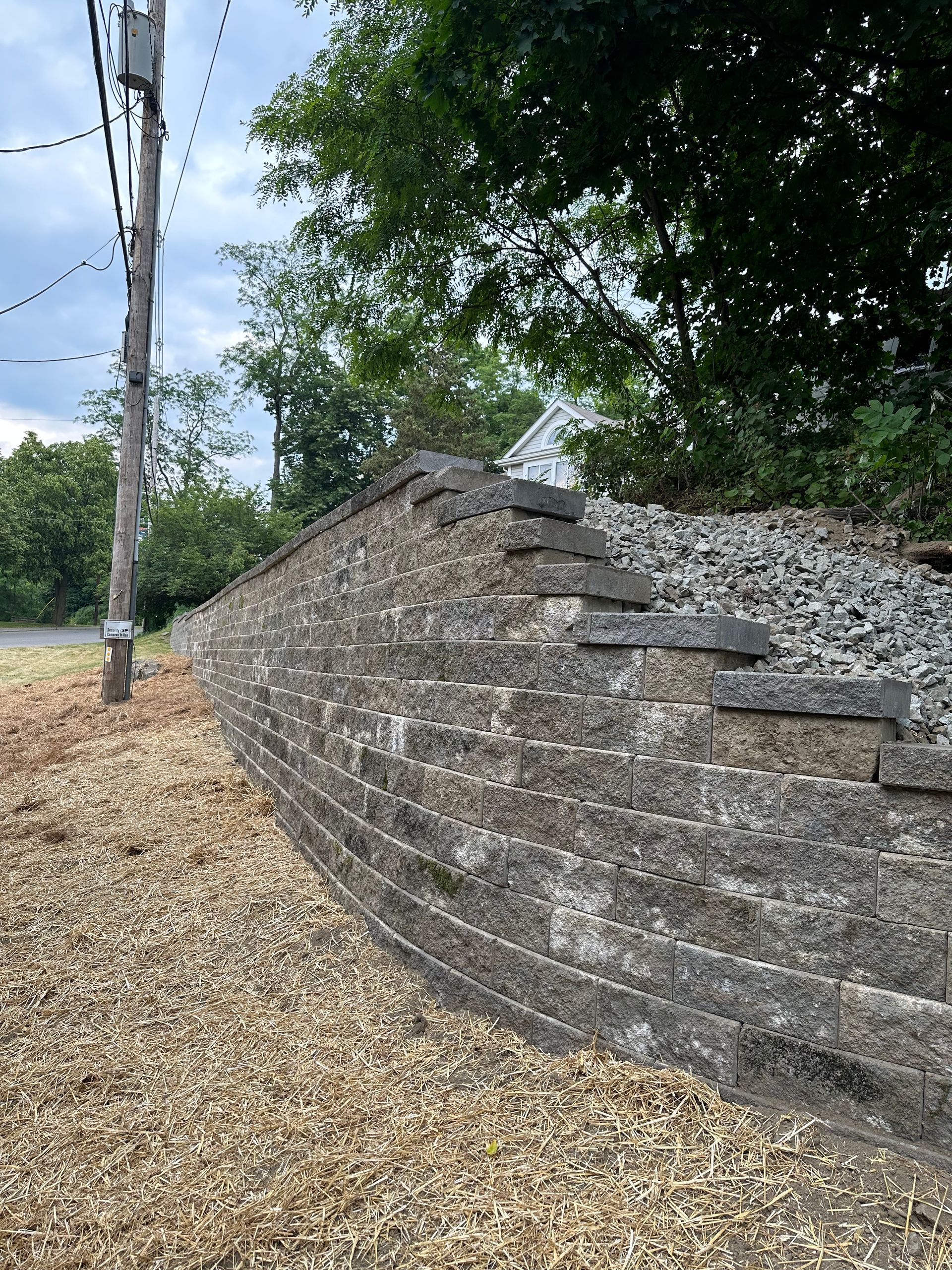 A brick wall with stairs leading up to it.