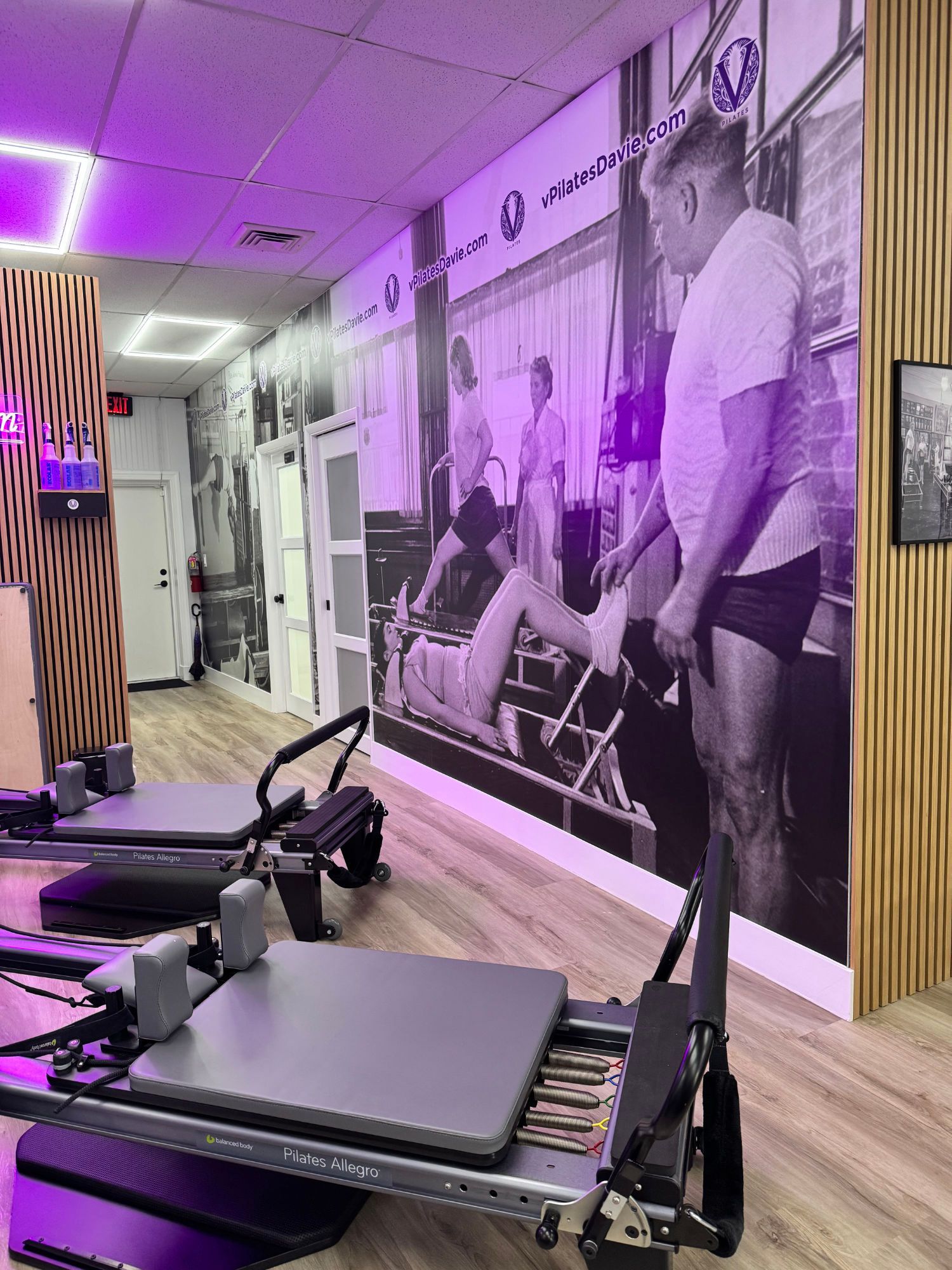 A group of people are doing pilates in a studio