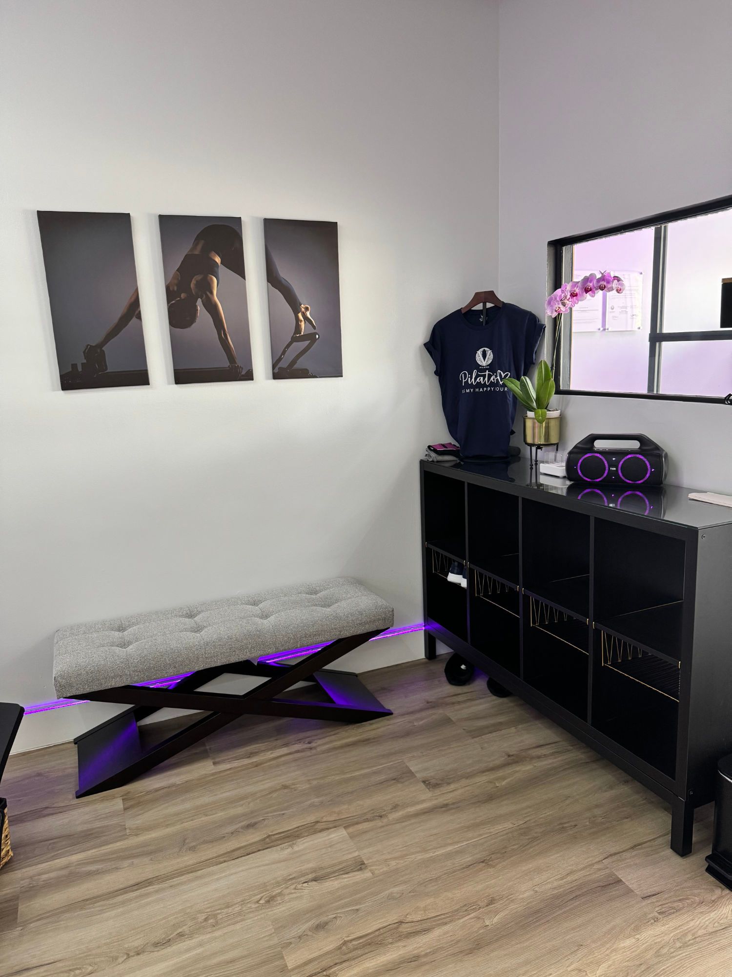 There is a bench in the corner of the room.