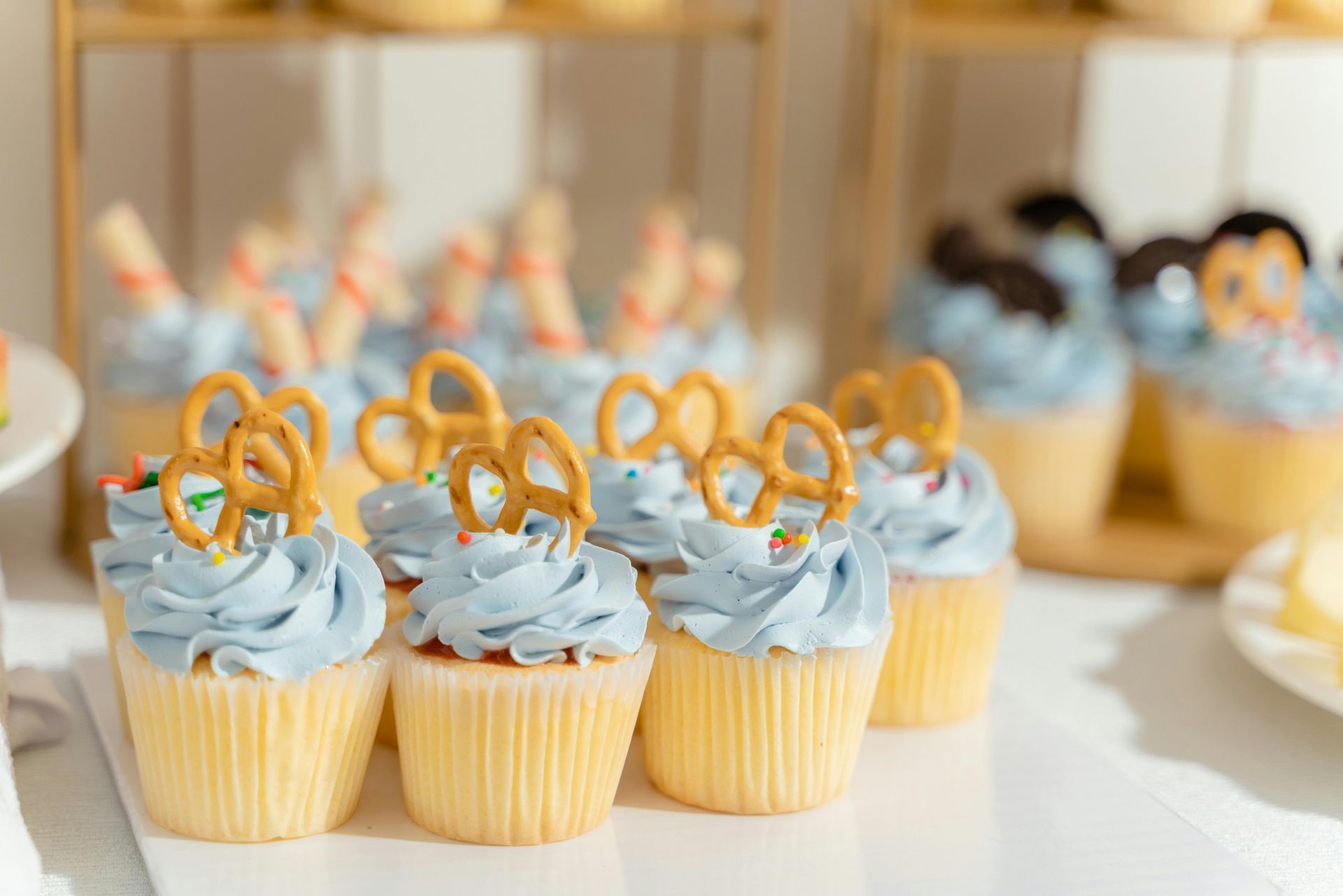 Cupcakes lined up with blue frosting
