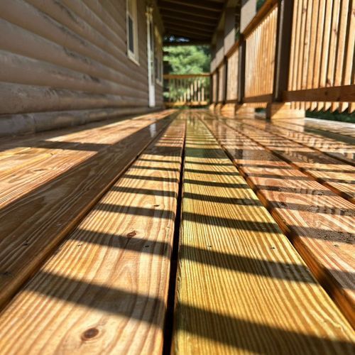 An empty kitchen with white cabinets , a stove , and a microwave.
