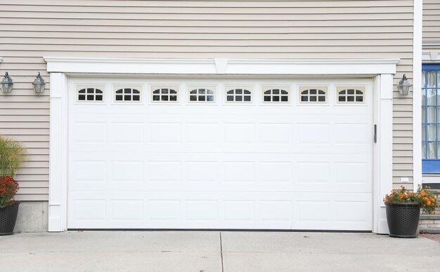 garage with a white door and arched windows