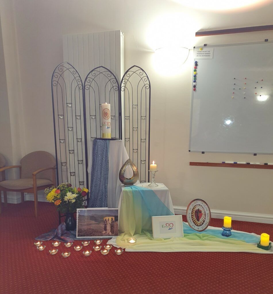 a room with a table and candles in it