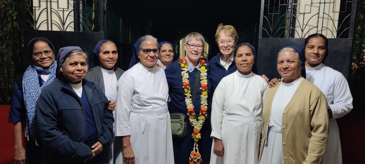 A group of women are posing for a picture together.