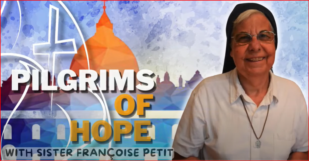 A nun, Sister Françoise Petit, smiles. Text: Pilgrims of Hope. Background has a cross and a building.