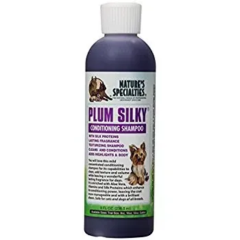 A bottle of plum silky conditioning shampoo for dogs.