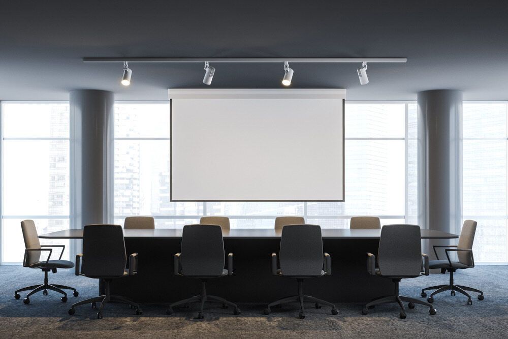 A Conference Room With a Long Table and Chairs and a Projector Screen — Frontier Connect in Gatton, QLD