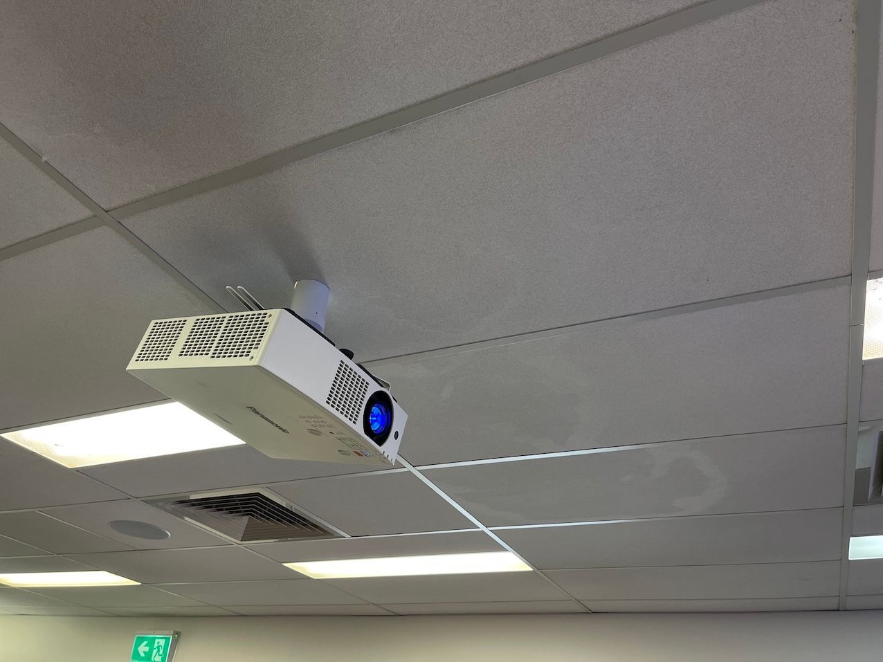 A Projector is Hanging From the Ceiling of a Building — Frontier Connect in Toowoomba, QLD