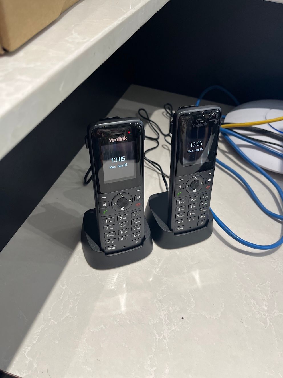 Two Battery Phones In Cradles — Frontier Connect in Dalby, QLD