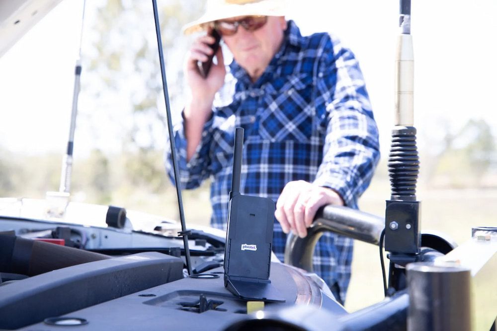A Man is Talking on a Cell Phone — Frontier Connect in Newtown, QLD