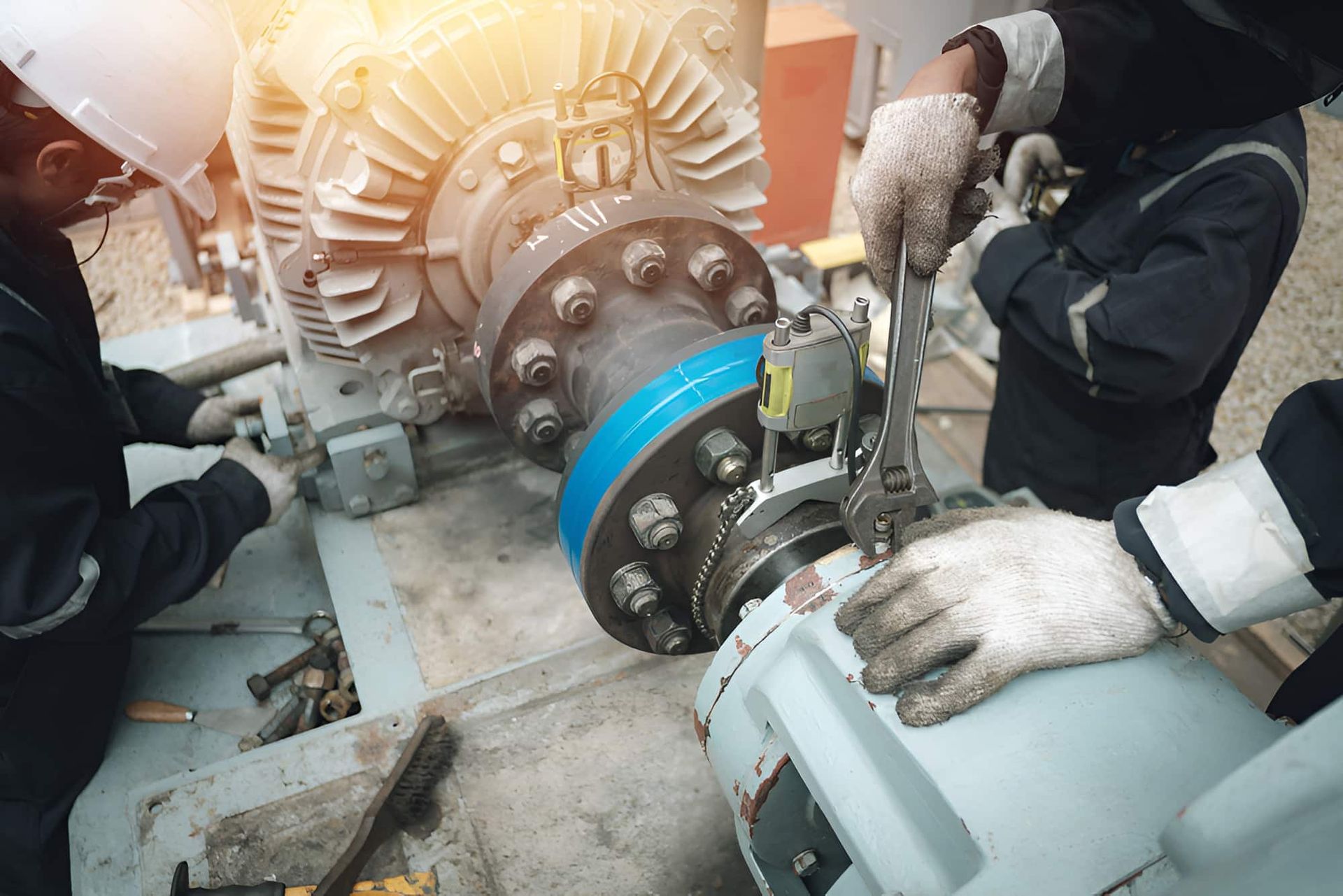 Workers in Protective Gear Repairing a Large Industrial Motor — Forcequip In Glanmire, QLD