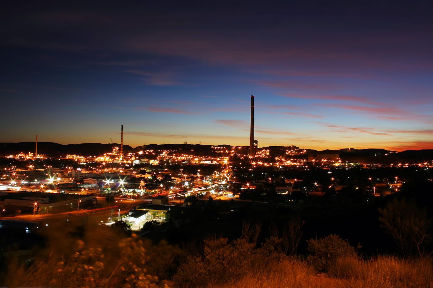 City at Dusk With Bright Lights Under a Dusky Blue and Orange Sky — Forcequip In Mount Isa, QLD