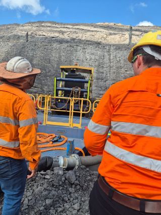 Two Workers in Orange Safety Vests — Forcequip Hire In Glanmire, QLD