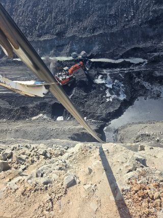 View Down a Steep Embankment Towards a Dark — Forcequip Hire In Glanmire, QLD