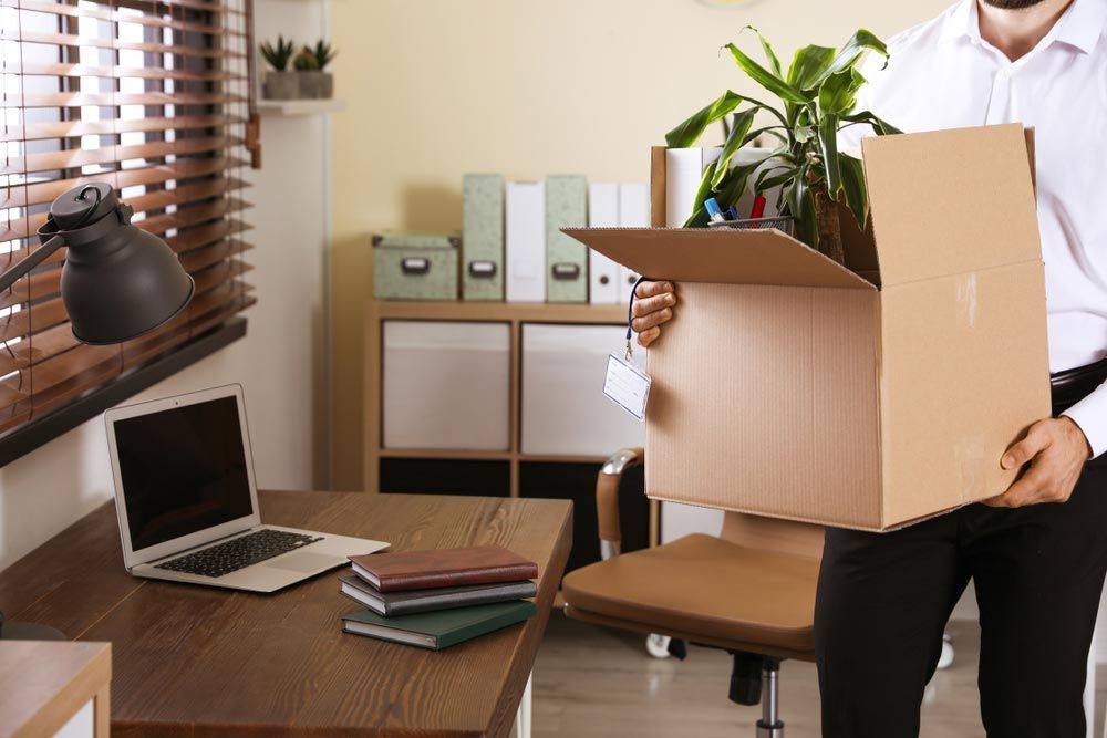 Man On The Office With A Moving Box