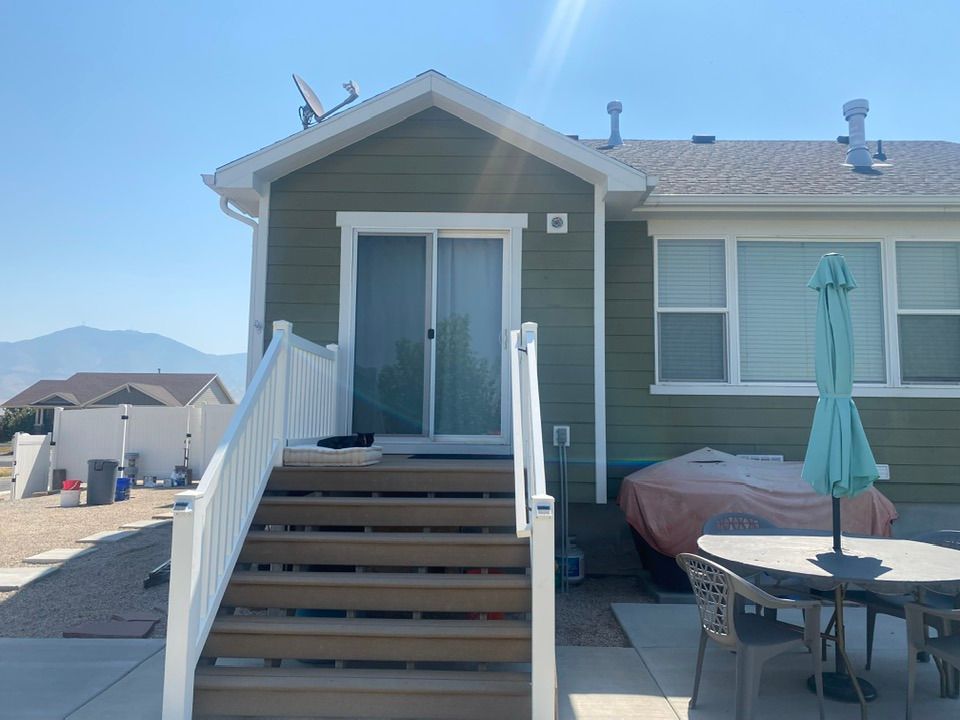 The back of a house with stairs leading up to it