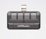 A lift master garage door remote control is sitting on a white surface.