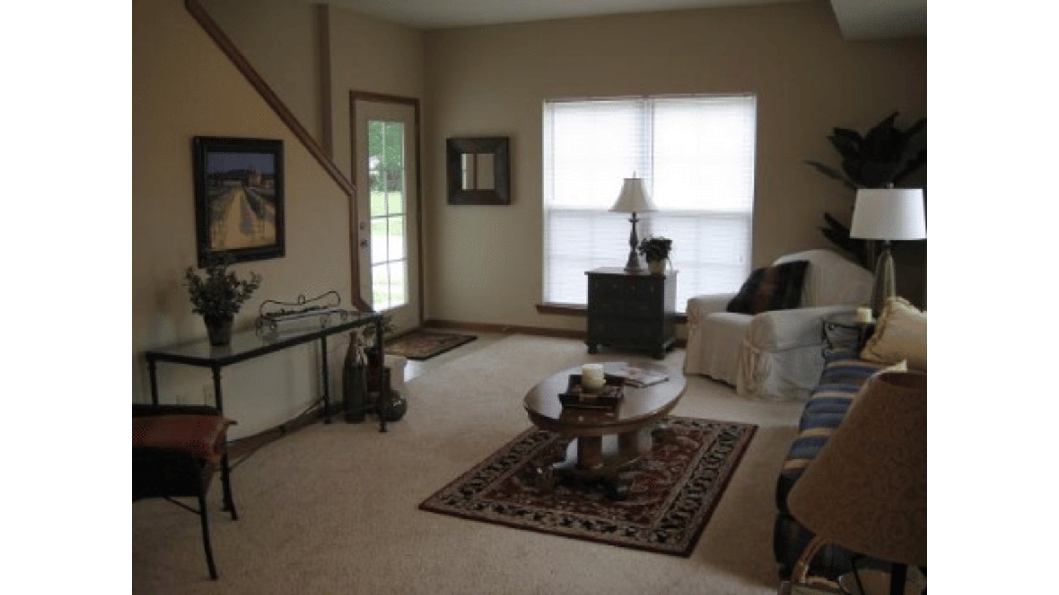 A living room with a couch and a table