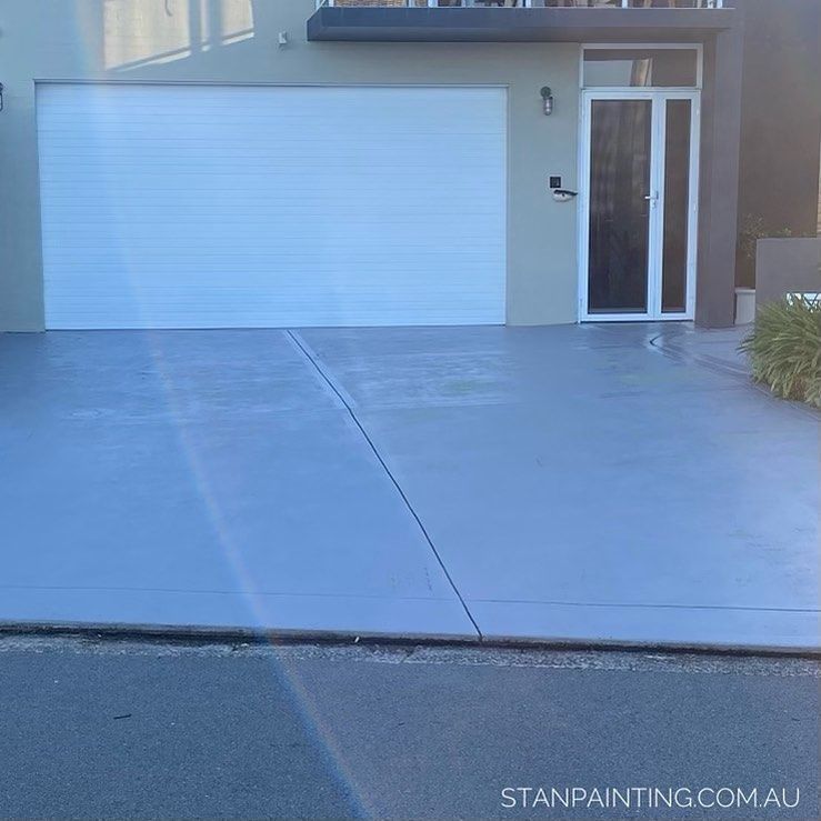 Gray Painted Driveway in Front of A Modern House — Stan Painting Services In Cessnock, NSW