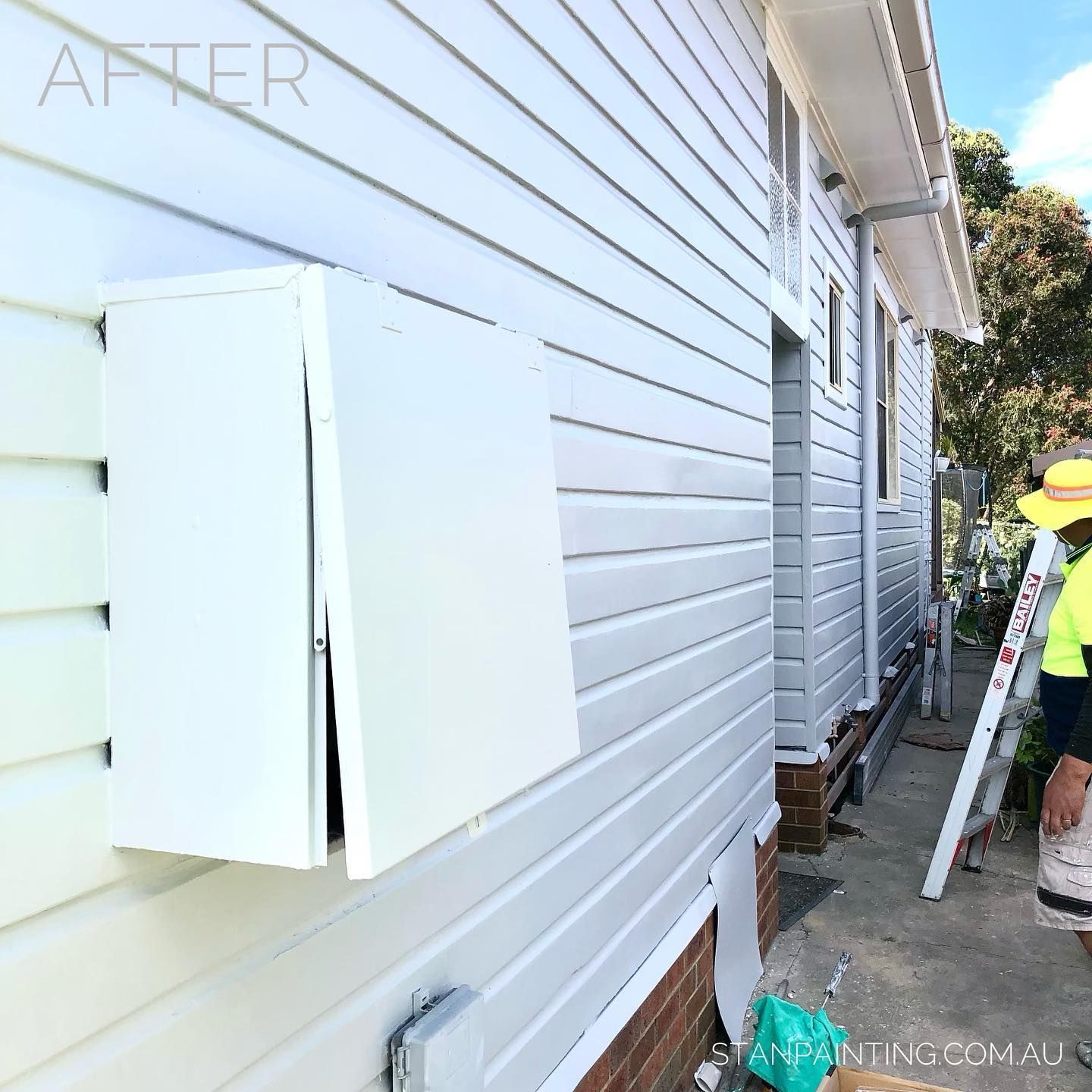 Exterior of A House with White Siding and A Large White Box on The Wall — Stan Painting Services In Thornton, NSW