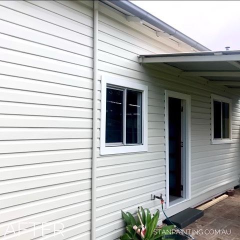 Side View of A Weathered Tan House with A Window — Stan Painting Services In Belmont, NSW