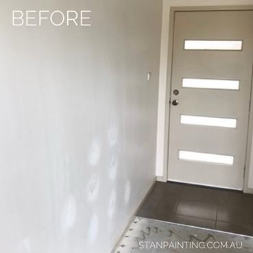 Wall with patch marks next to a door with horizontal windows; 