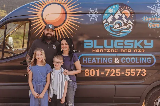 Family posing beside BlueSky Heating & Cooling van with company logo and phone number.