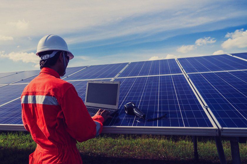 Worker Checking Solar Panel — Solar Installers in Forbes , NSW