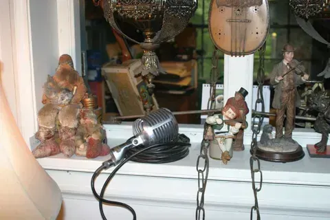 A Microphone Next to Statues