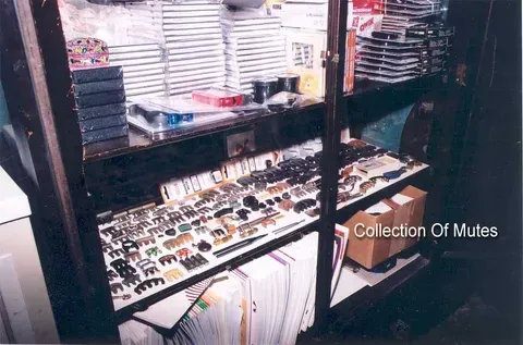 A Collection of Mutes in a Glass Case