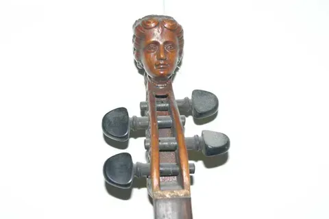 A Violin with a Carved Head on Headstock