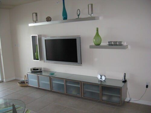 Cabinets and TV Mounted on Wall — furniture repair in Cape Coral, FL